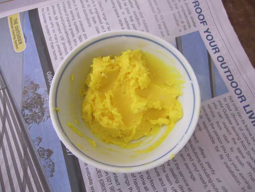 white bowl of bright yellow egg-yolk paste