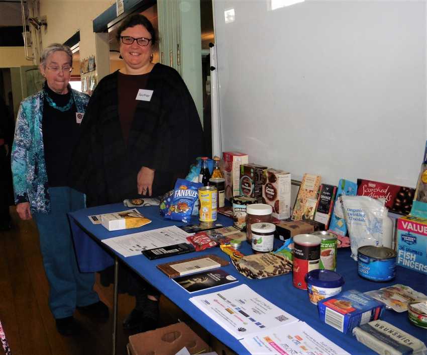 Heather and Maybeth alongside the Just Kai display table