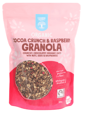 A pink bag of granola (light pink at top dark pink at the bottom) with product name in brown and the blue Chantal logo at the top and the Fairtrade logo bottom right.
